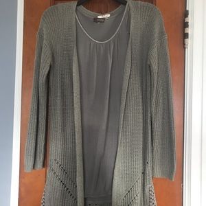 Women’s 2 piece tank is Large, Sweater is Small.